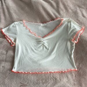 White tee with orange trimming